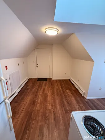 a view of a room with wooden floor and utility
