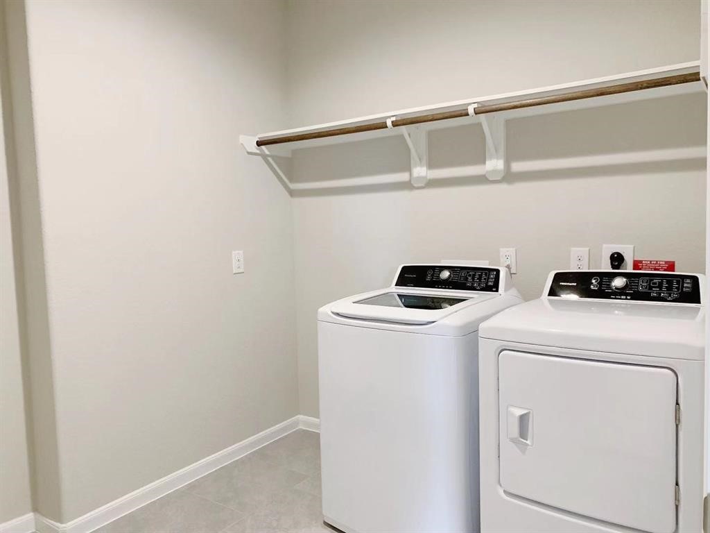 29026 Endeavor River Road Katy, TX 77494 - Photo 20 of 27 a utility room with dryer and washer