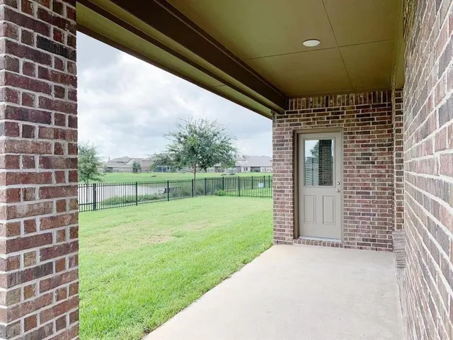 a front view of a house with a yard table and chairs