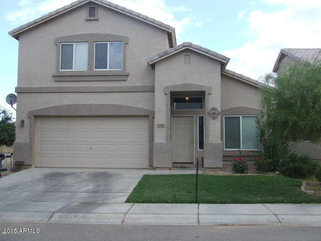 718 West Spruell Avenue Coolidge, AZ 85128 - Photo 1 of 15 a house that has a lot of windows
