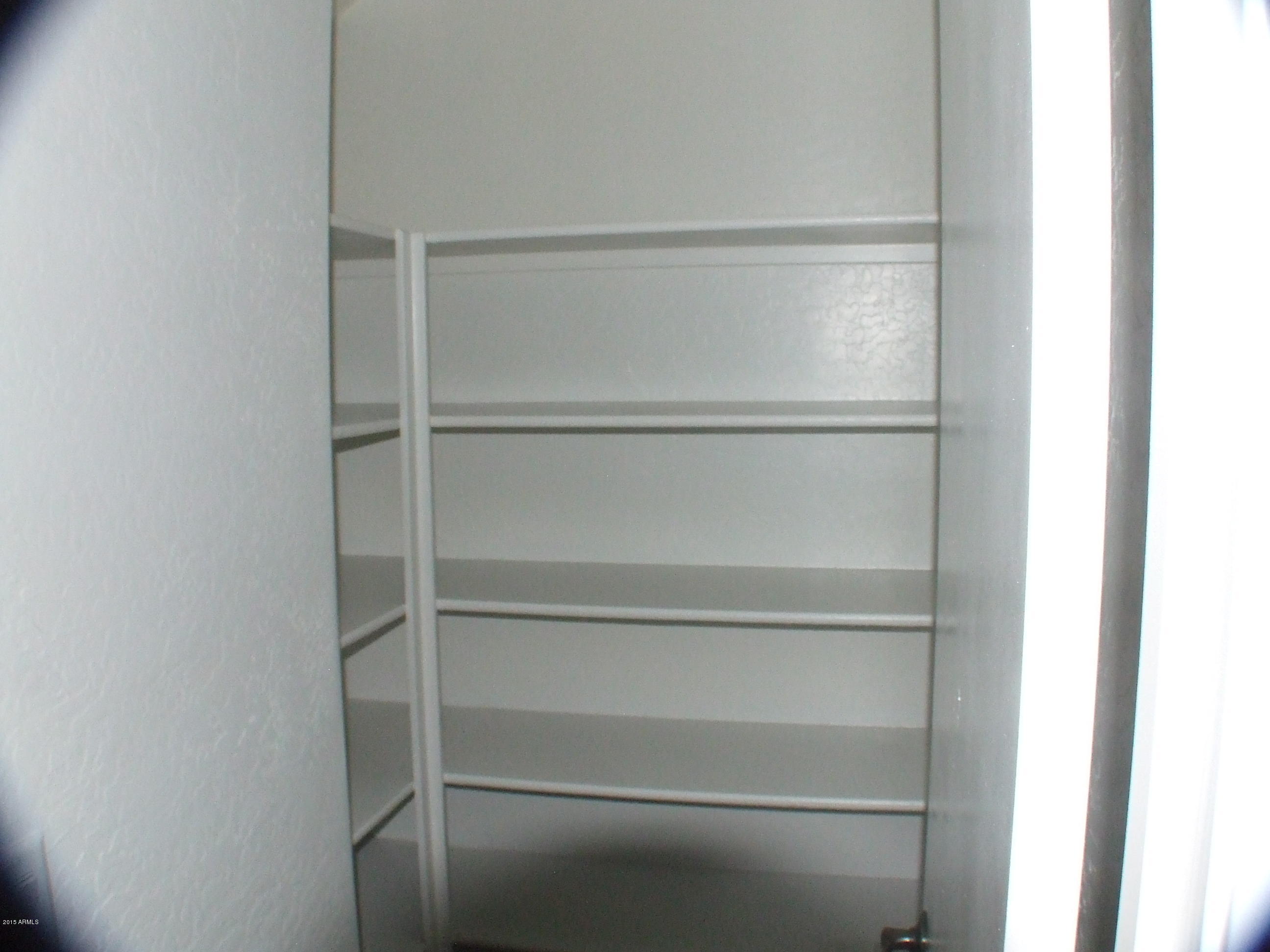 718 West Spruell Avenue Coolidge, AZ 85128 - Photo 11 of 15 a view of an empty walk in closet