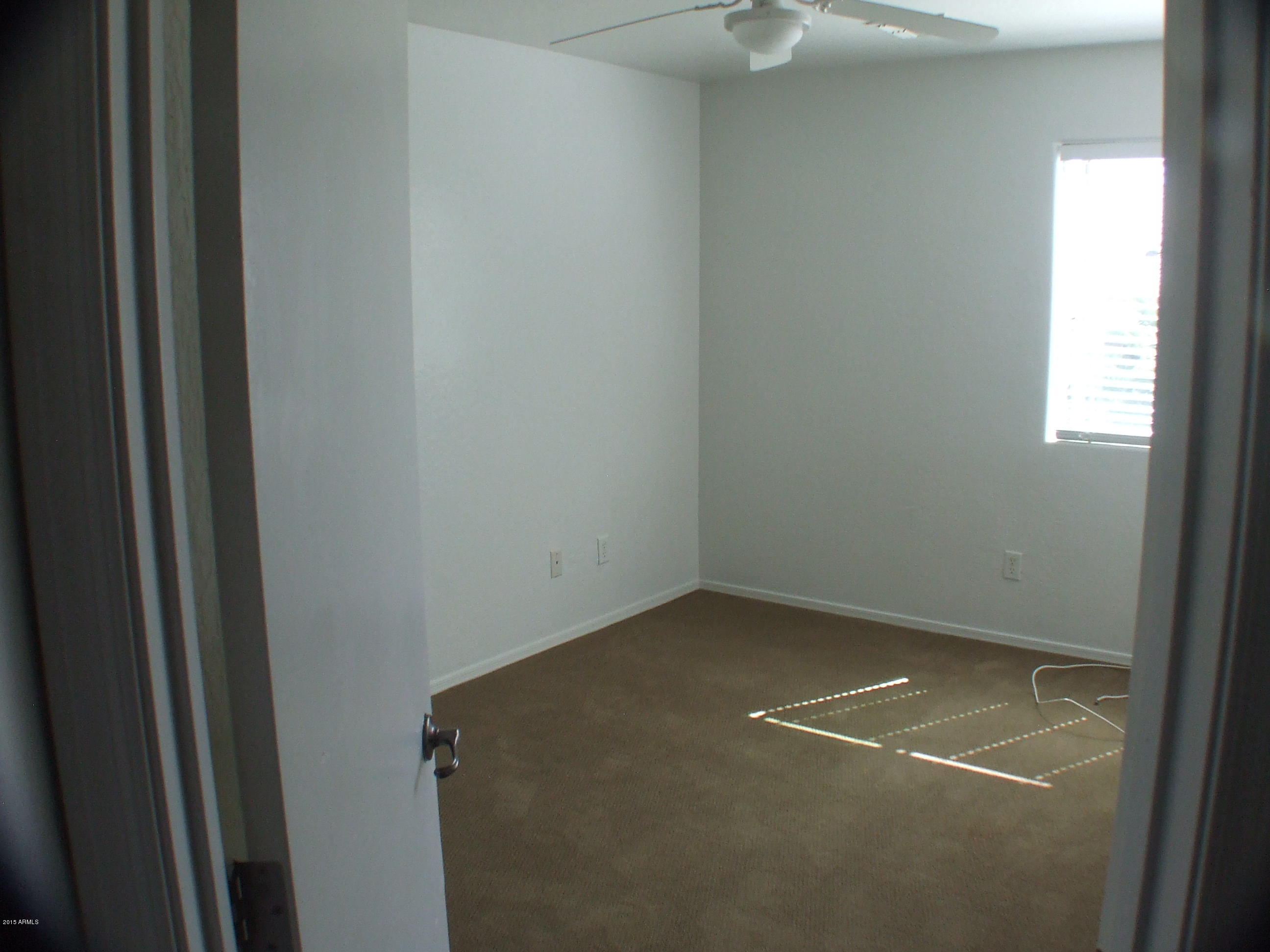 718 West Spruell Avenue Coolidge, AZ 85128 - Photo 13 of 15 a view of a small space with a window