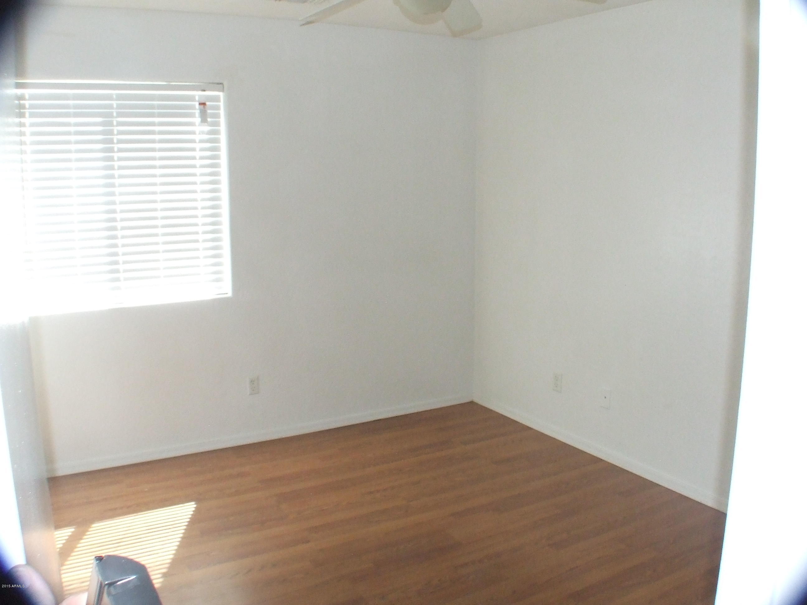 718 West Spruell Avenue Coolidge, AZ 85128 - Photo 14 of 15 an empty room with a window