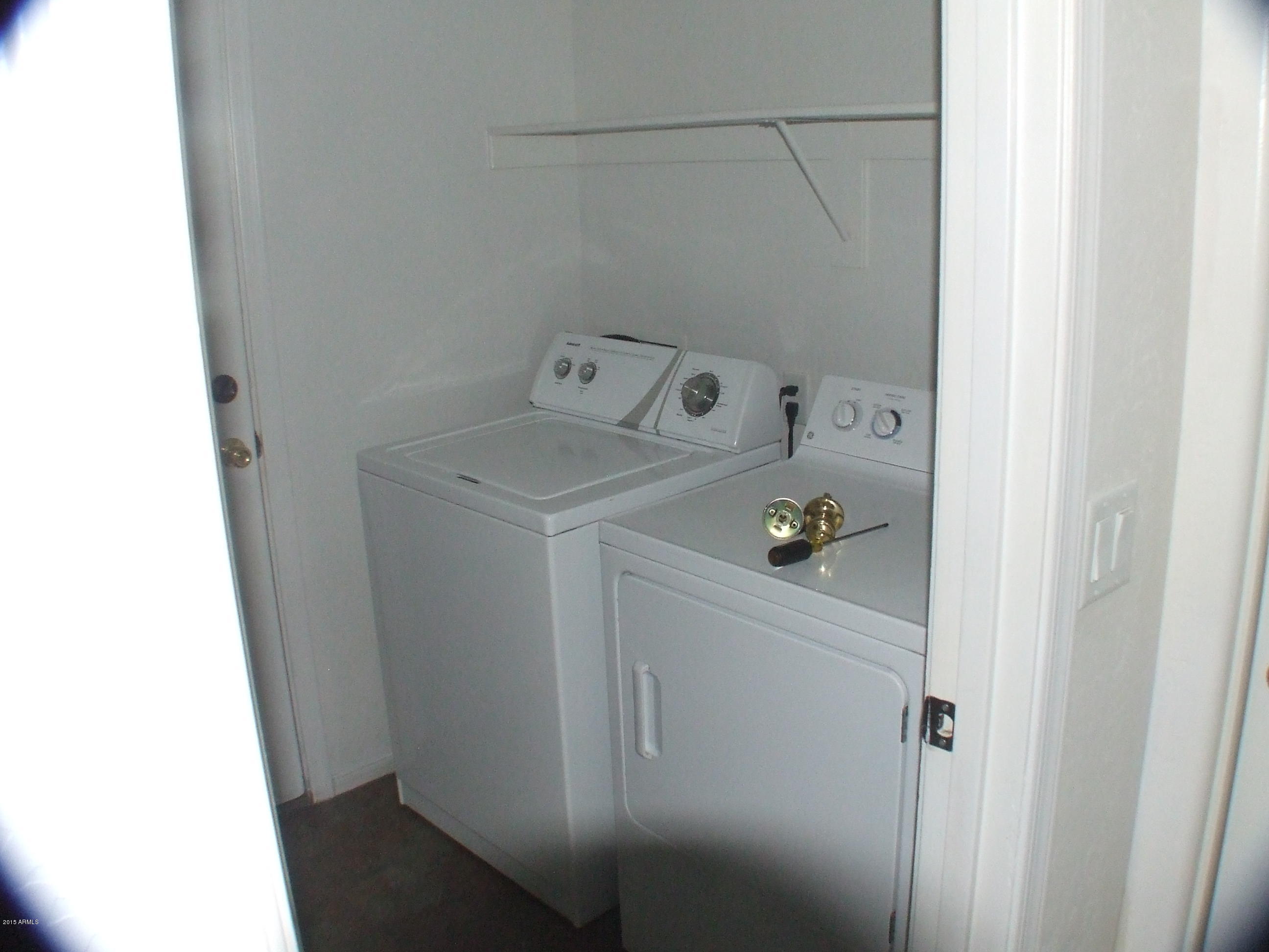 718 West Spruell Avenue Coolidge, AZ 85128 - Photo 10 of 15 a utility room with dryer and washer