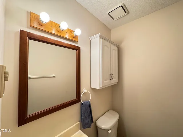 a en suite bathroom with a sink and a mirror