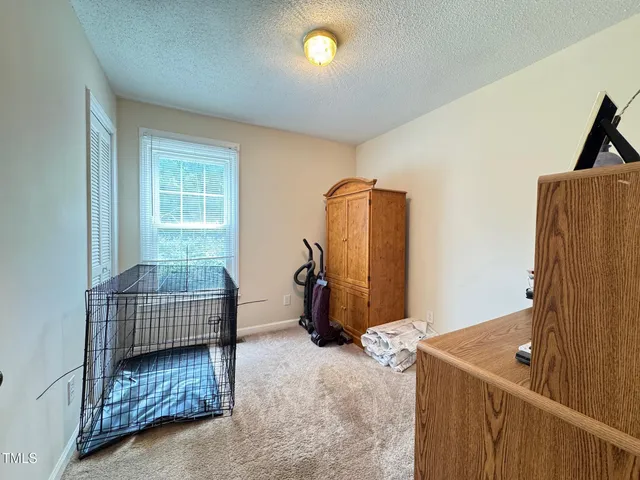 a kitchen with stainless steel appliances granite countertop a refrigerator a stove a sink dishwasher with a dining table and chairs