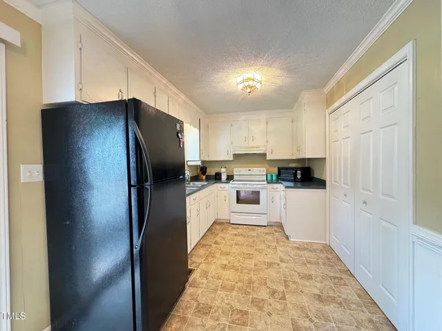 a very nice looking dining room with a large window