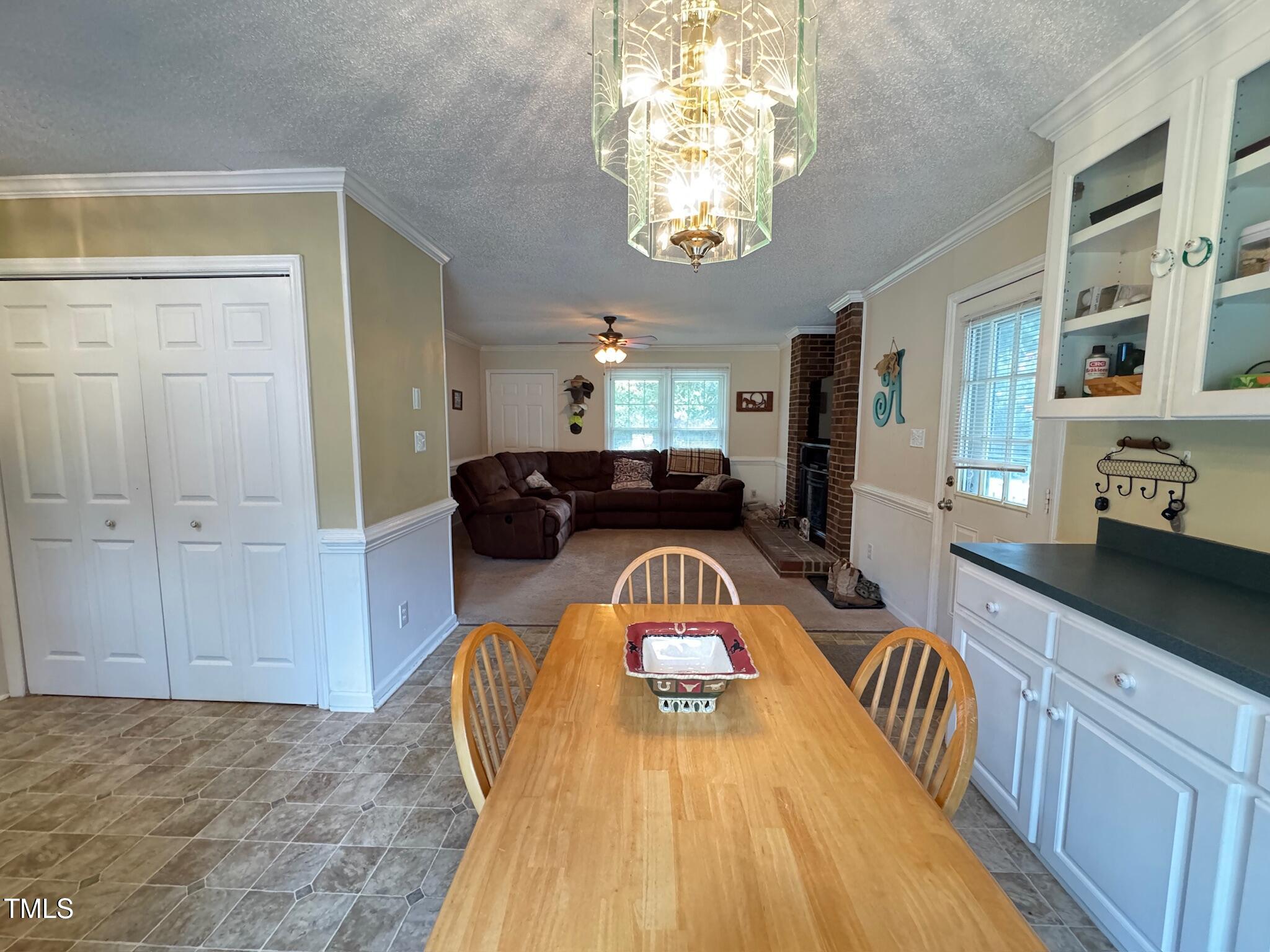 2229 Lizard Lick Road Zebulon, NC 27597 - Photo 34 of 57 a very nice looking dining room with a large window