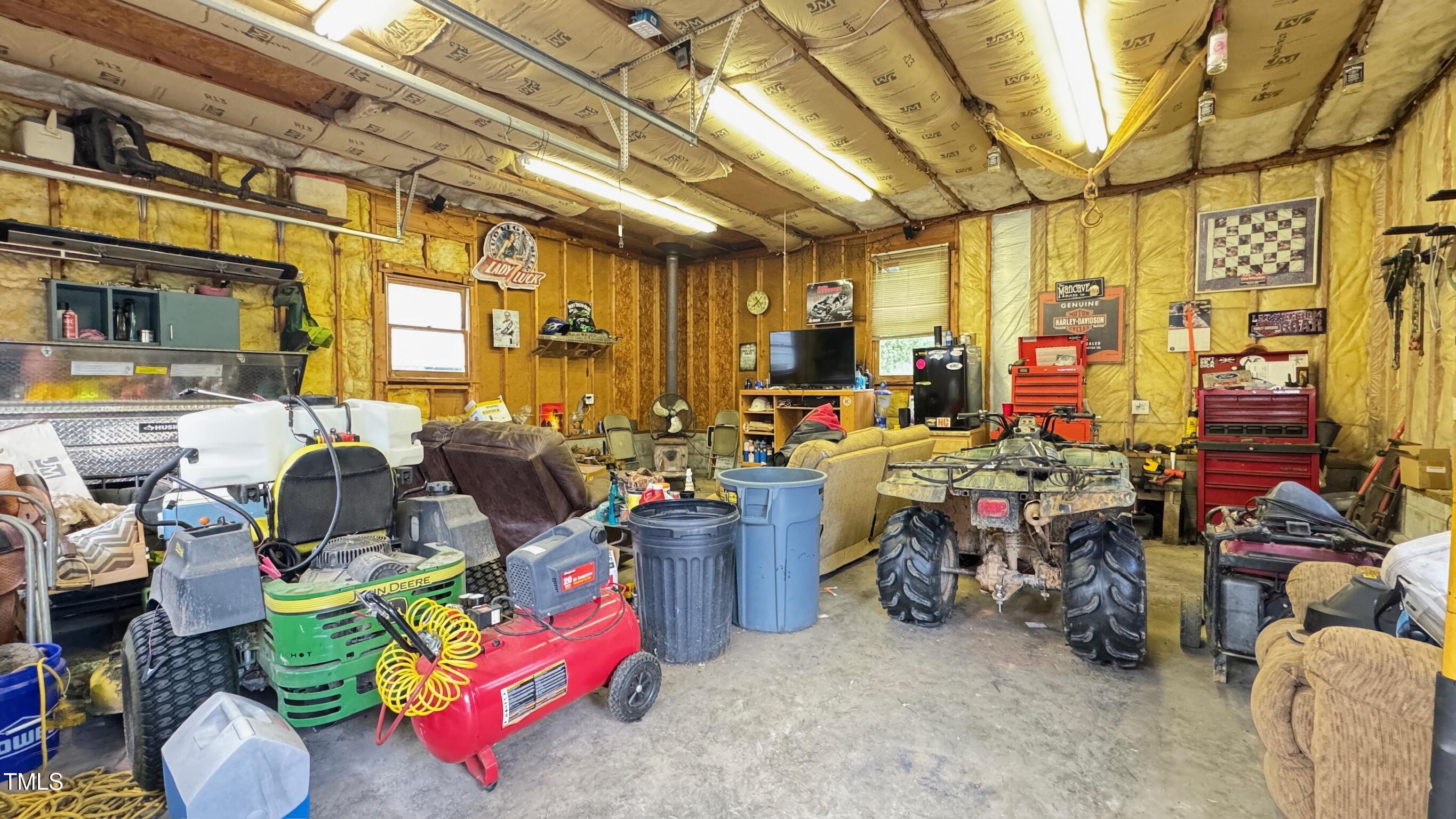 2229 Lizard Lick Road Zebulon, NC 27597 - Photo 44 of 57 a storage room with lots of furniture and clutter
