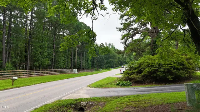 an aerial view of a house with yard