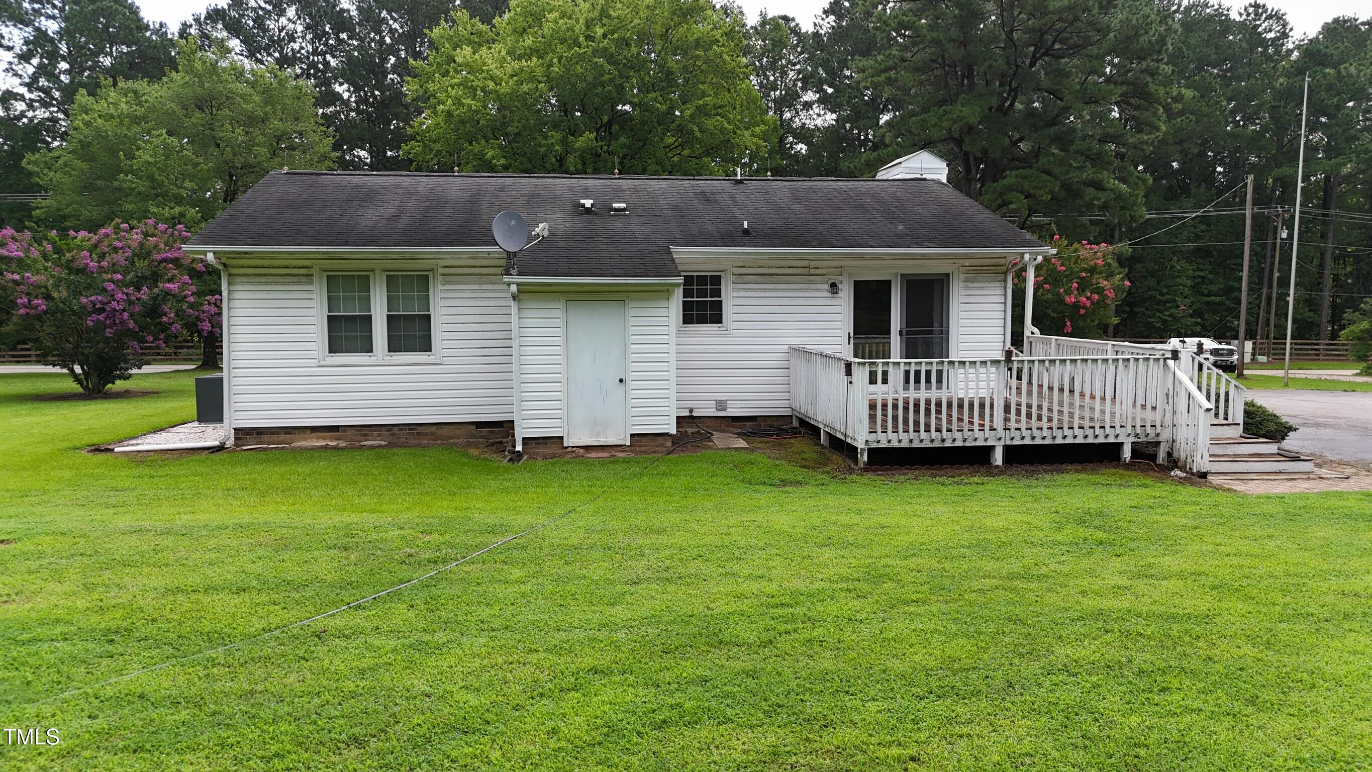 2229 Lizard Lick Road Zebulon, NC 27597 - Photo 5 of 57 a front view of house with yard and green space