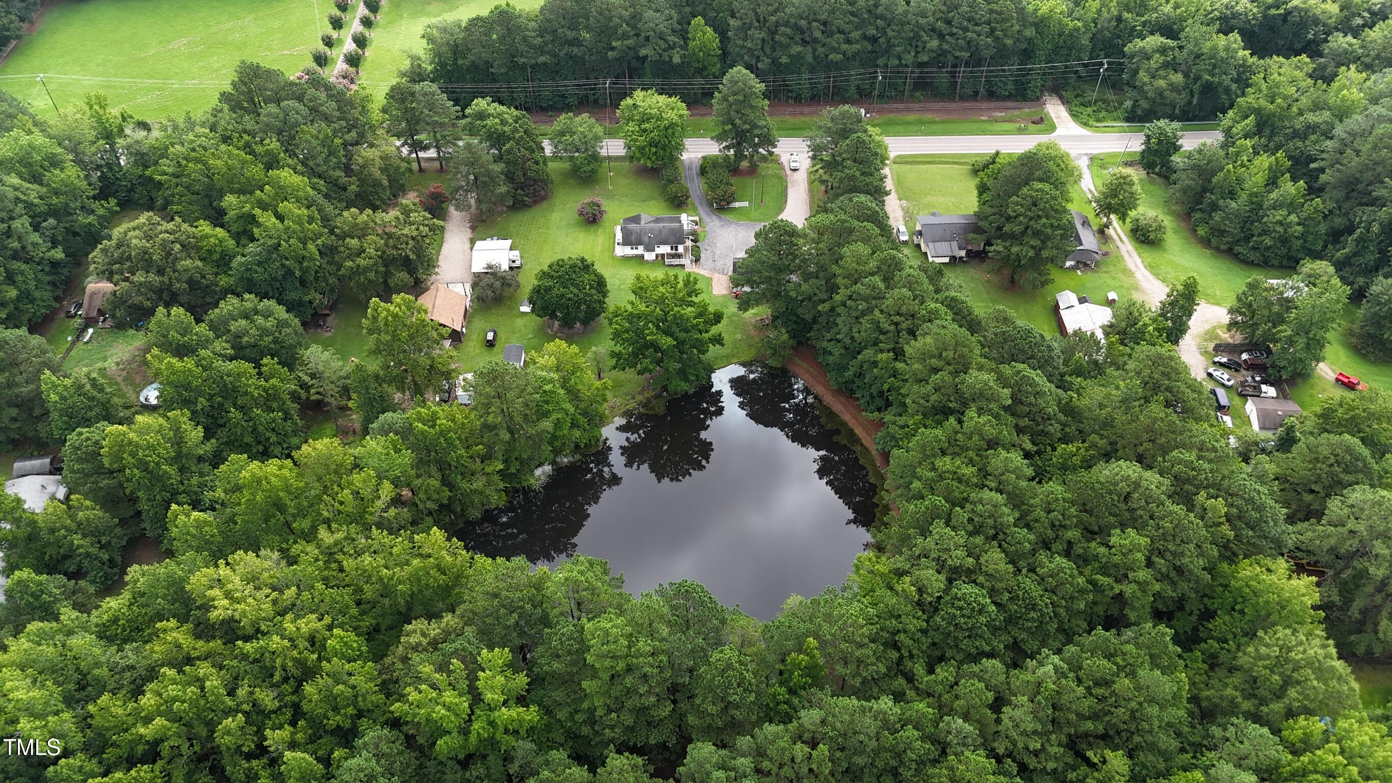 2229 Lizard Lick Road Zebulon, NC 27597 - Photo 55 of 57 an aerial view of a house with a yard swimming pool and outdoor seating