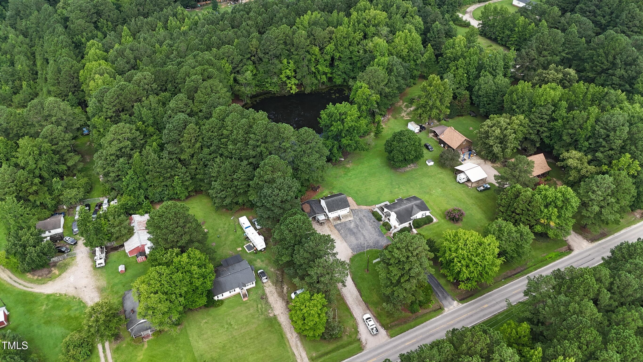 2229 Lizard Lick Road Zebulon, NC 27597 - Photo 56 of 57 an aerial view of a house with yard