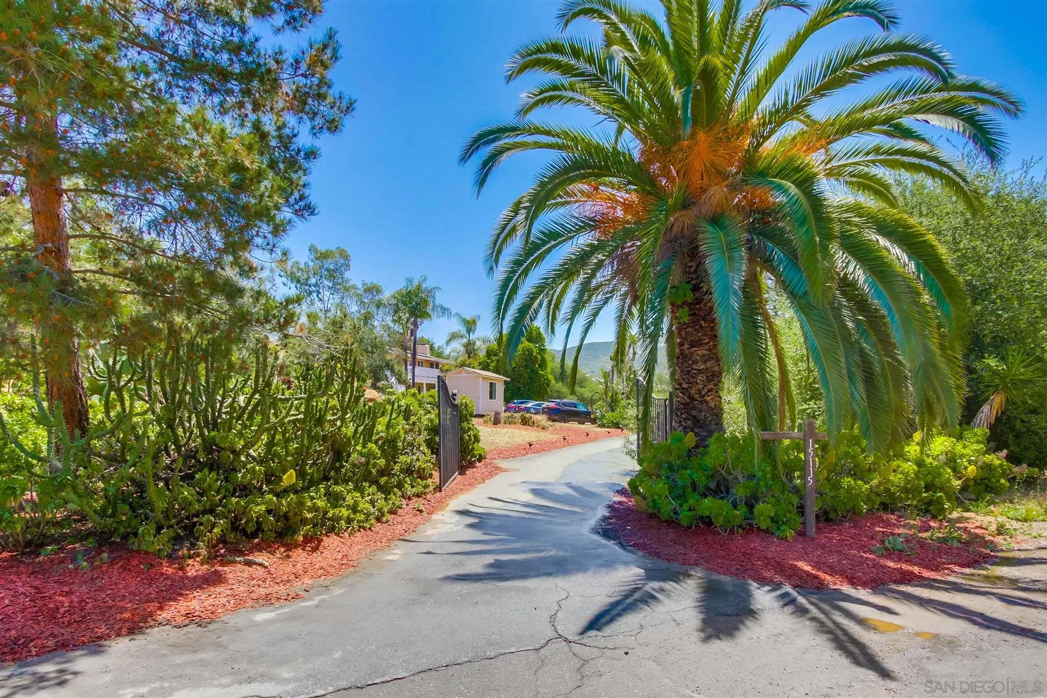 15115 Eastvale Road Poway, CA 92064 - Photo 1 of 31 a view of a backyard of a house