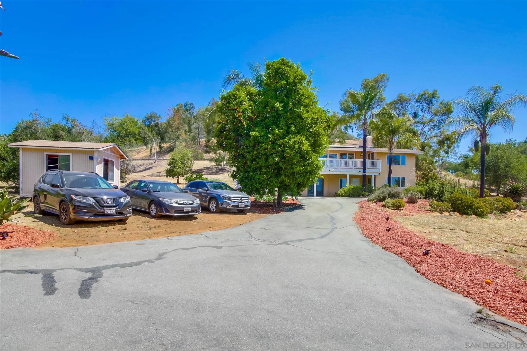 15115 Eastvale Road Poway, CA 92064 - Photo 30 of 31 front view of a house with a street view