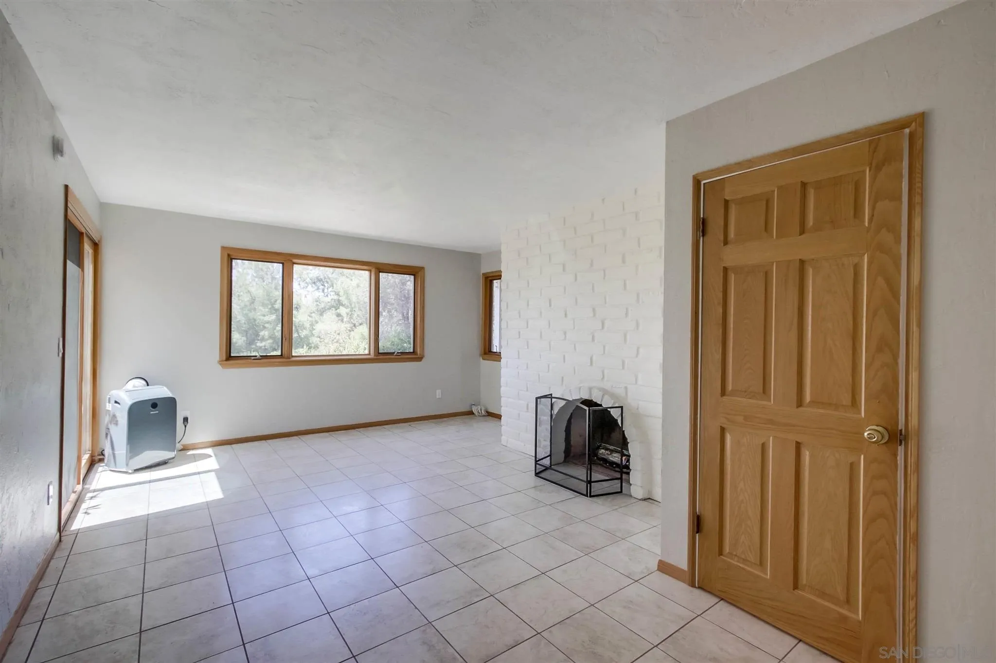 15115 Eastvale Road Poway, CA 92064 - Photo 8 of 31 a view of a livingroom with a couch and a window