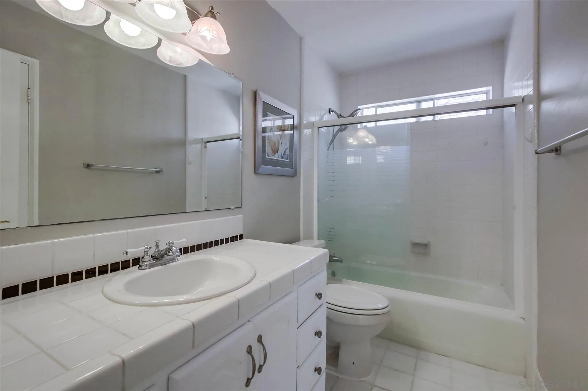 15115 Eastvale Road Poway, CA 92064 - Photo 9 of 31 a bathroom with a sink toilet tub and shower