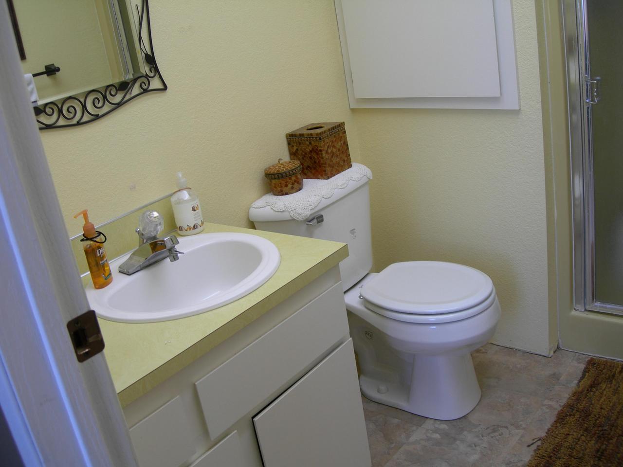 210 Liberty Road Granger, WA 98932 - Photo 6 of 8 a bathroom with a sink toilet and mirror