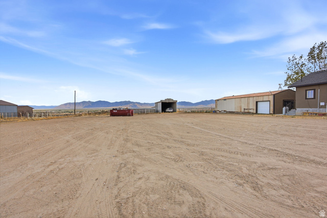 169 Taylor Road, Unit 101 Grantsville, UT 84029 - Photo 40 of 47 Expansive open lot featuring a detached 2 car garage with a large shed behind the garage and an additional outbuilding.