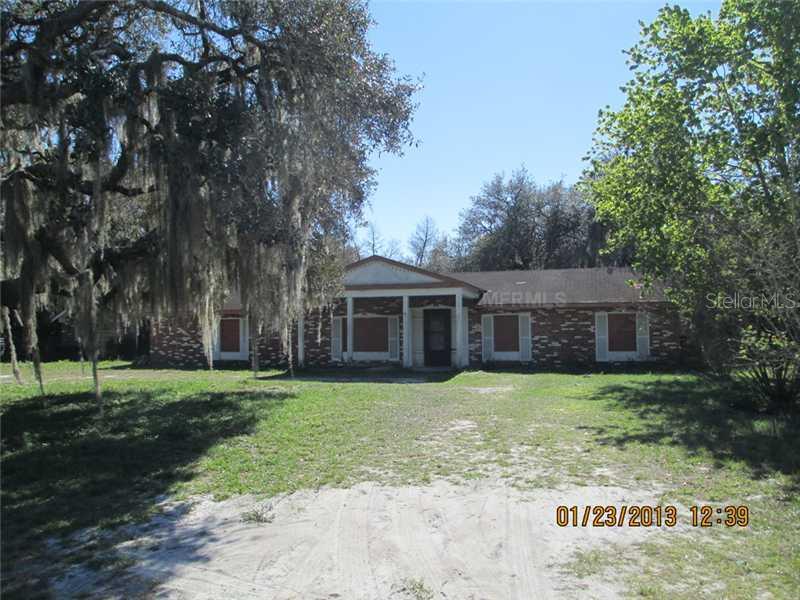 208 West Socrum Loop Road Lakeland, FL 33809 - Photo 1 of 1 a view of a yard in front of a house with a large tree