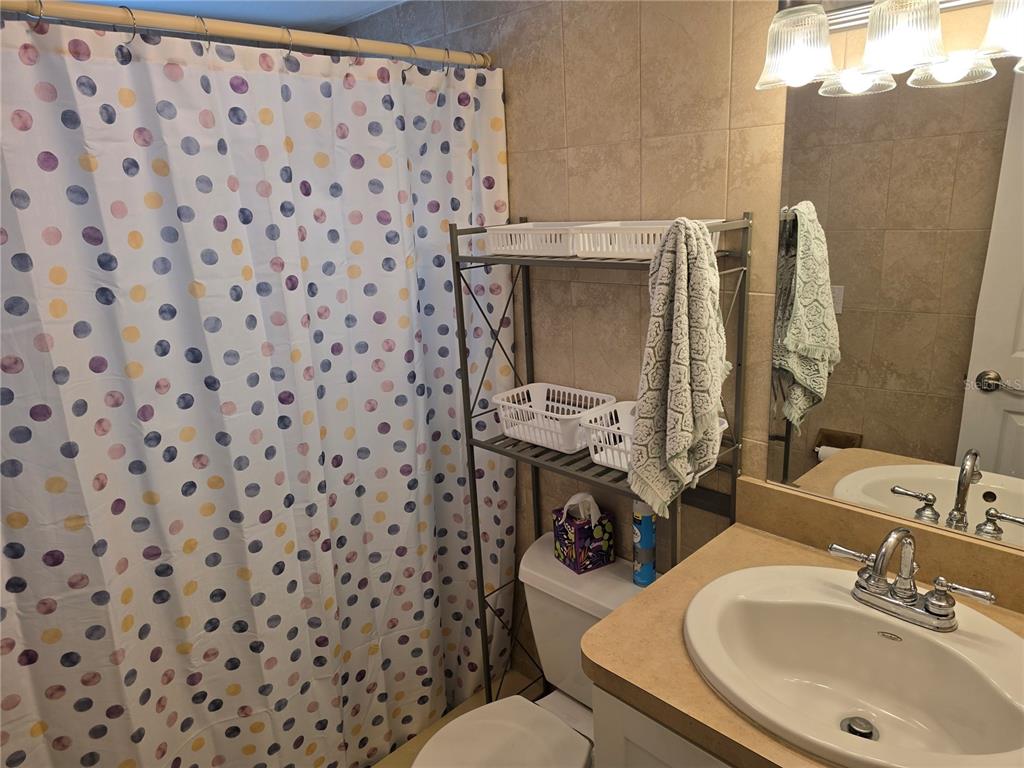 5850 Welcome Road, Unit J6 Bradenton, FL 34207 - Photo 14 of 30 a bathroom with a sink and a mirror