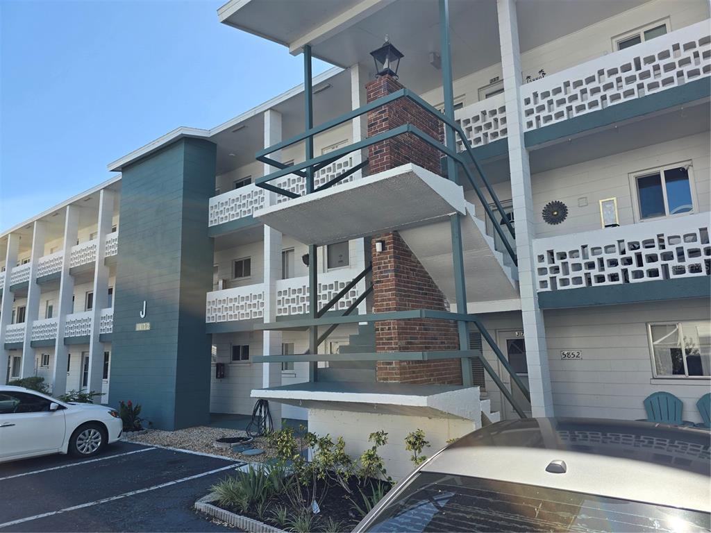 5850 Welcome Road, Unit J6 Bradenton, FL 34207 - Photo 2 of 30 a front view of a house with parking space