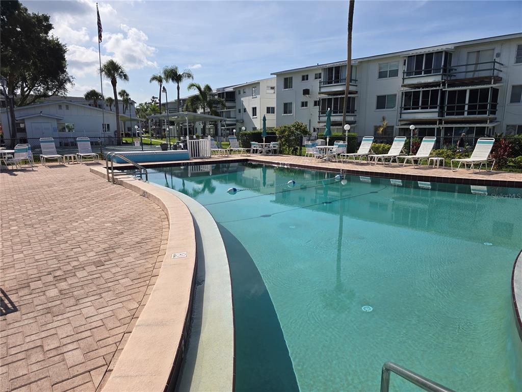 5850 Welcome Road, Unit J6 Bradenton, FL 34207 - Photo 27 of 30 a view of swimming pool with outdoor seating and lake view