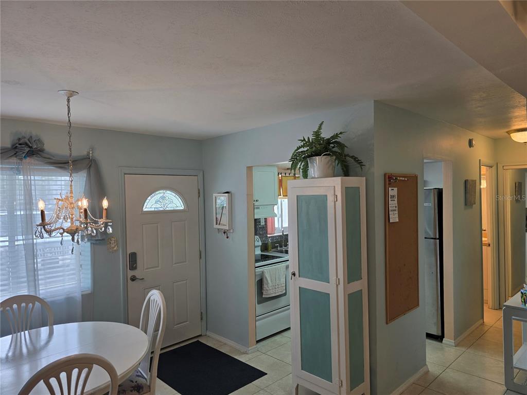 5850 Welcome Road, Unit J6 Bradenton, FL 34207 - Photo 9 of 30 a kitchen with stainless steel appliances a refrigerator and a stove