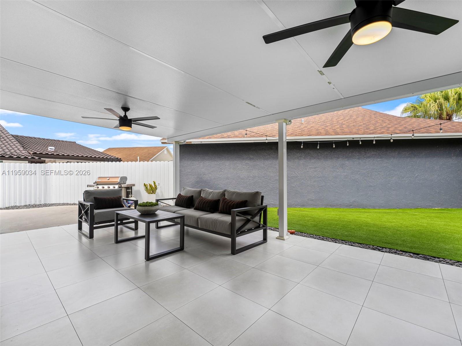 7753 Northwest 189th Street, Unit 1 Hialeah, FL 33015 - Photo 26 of 30 a living room with furniture