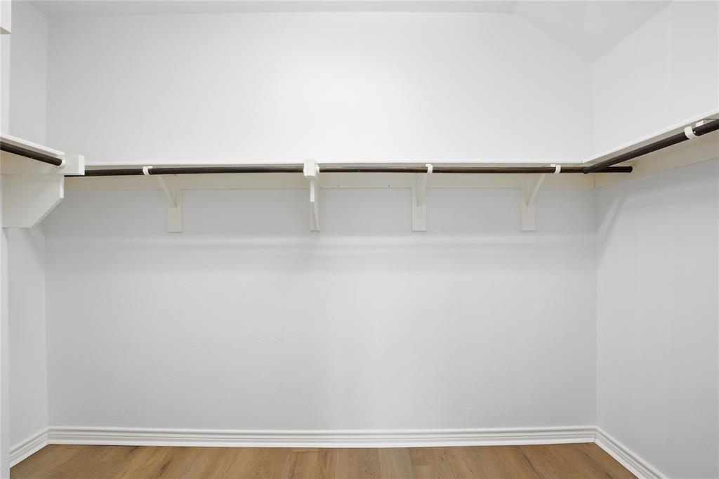 339 Blanco Drive Forney, TX 75126 - Photo 21 of 24 Walk in closet with light wood finished floors