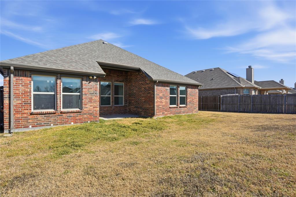 339 Blanco Drive Forney, TX 75126 - Photo 24 of 24 Rear view of house with brick siding, a patio area, and roof with shingles