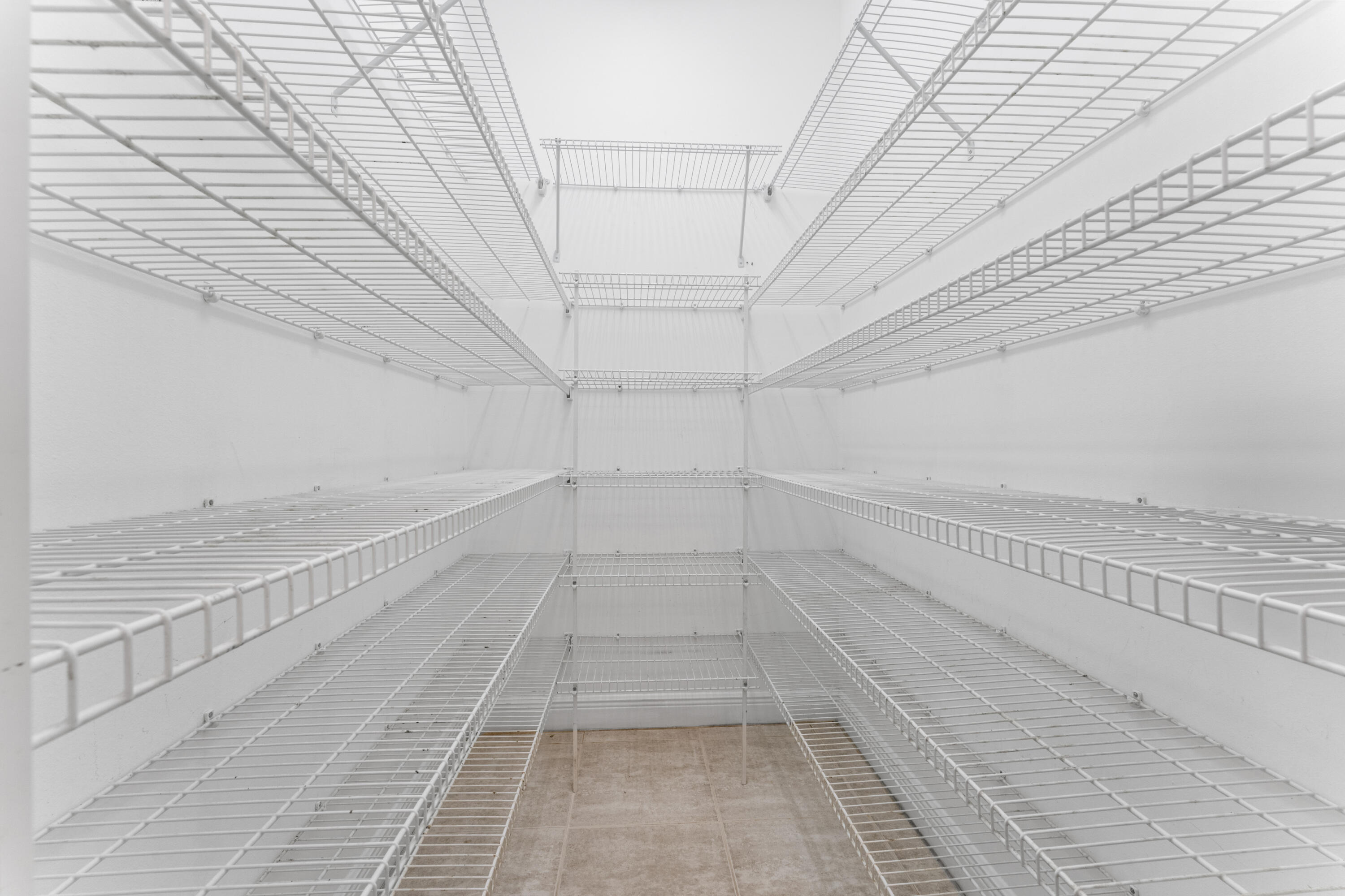 918 Southwest Blue Stem Way Stuart, FL 34997 - Photo 14 of 47 a view of an empty walk in closet