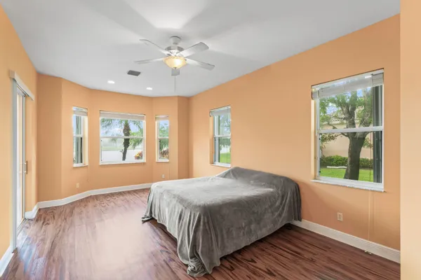 a bedroom with a large bed and a window