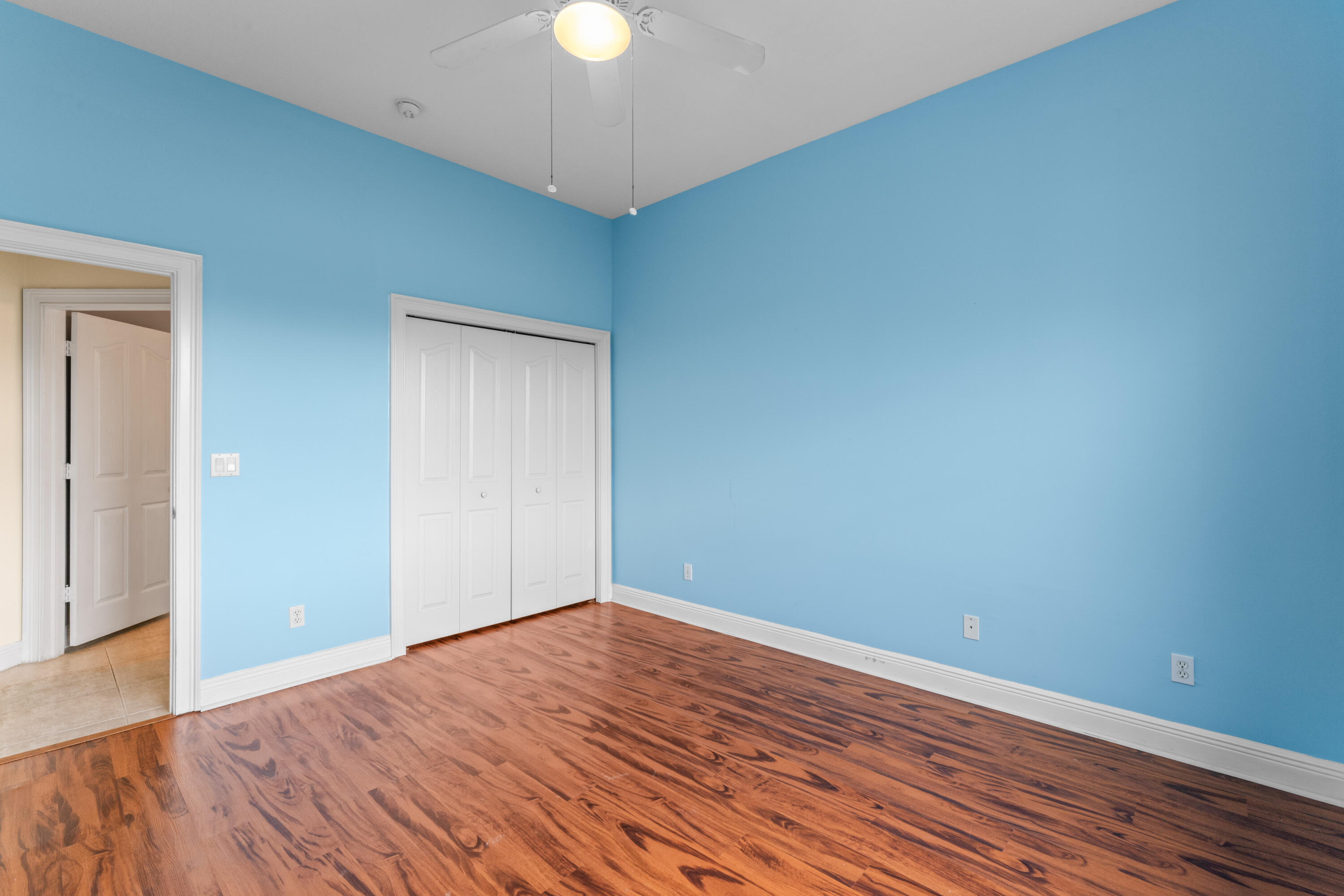918 Southwest Blue Stem Way Stuart, FL 34997 - Photo 27 of 47 a view of empty room with wooden floor