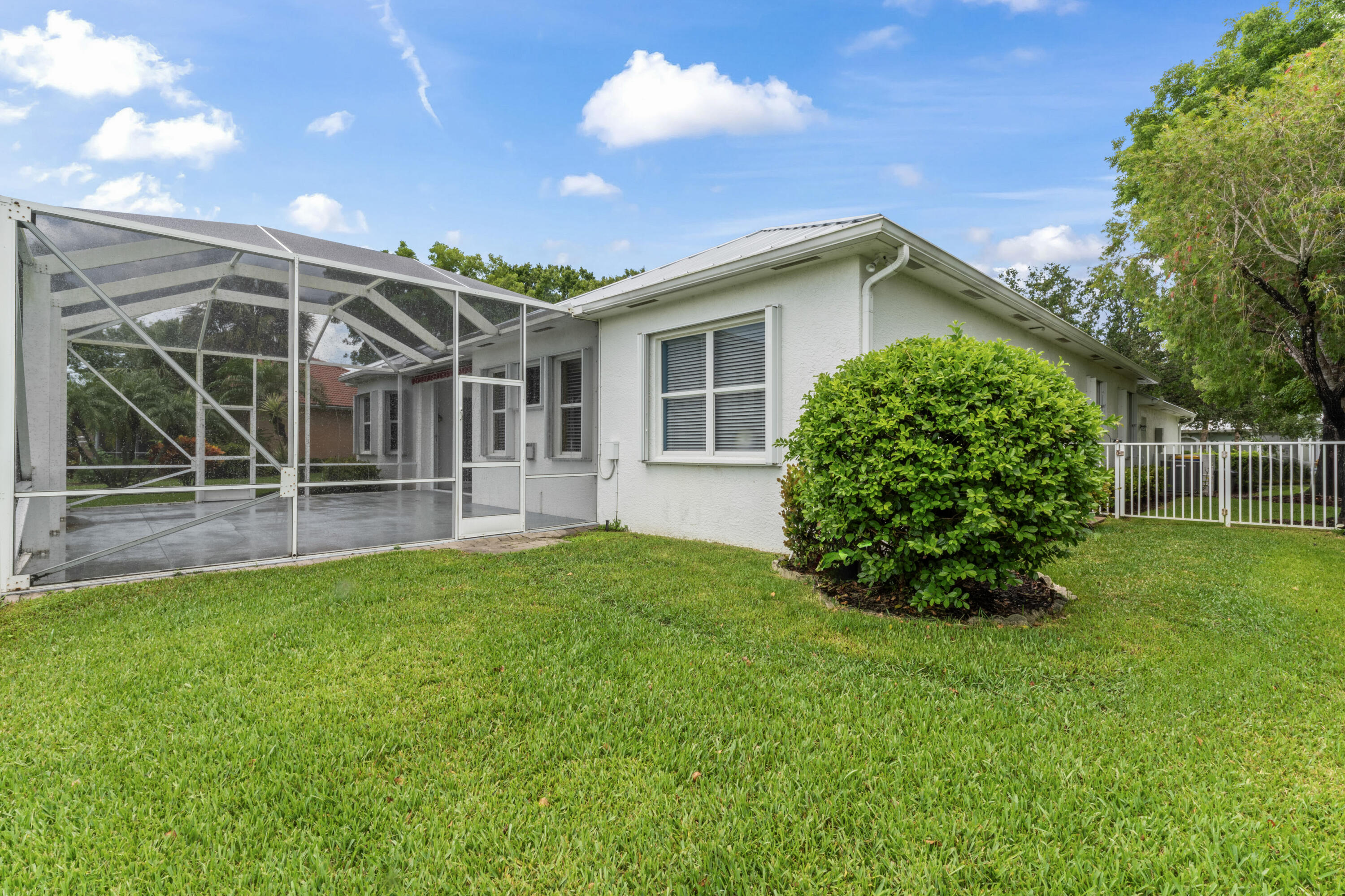 918 Southwest Blue Stem Way Stuart, FL 34997 - Photo 39 of 47 a view of a house with backyard and a tree