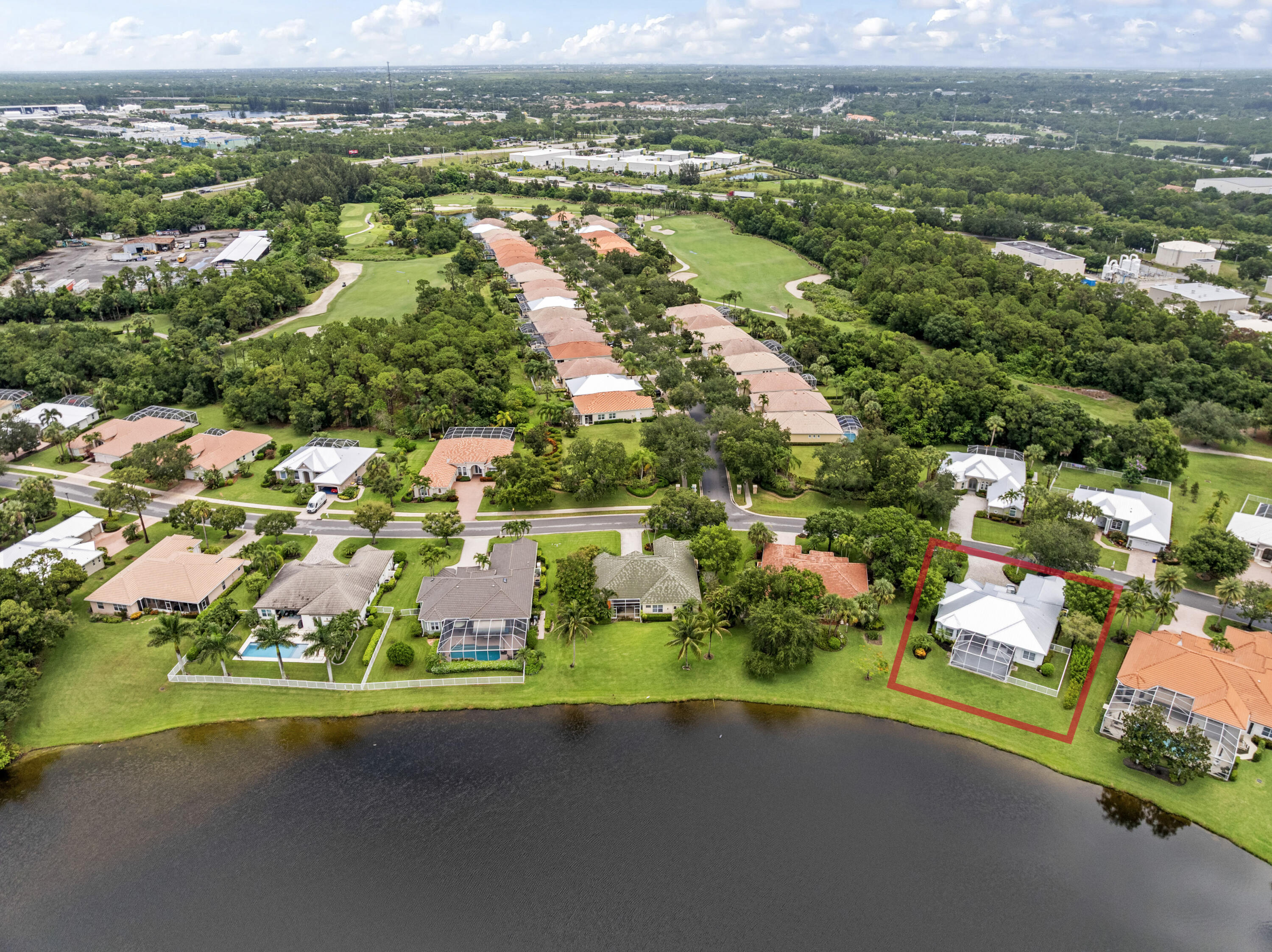 918 Southwest Blue Stem Way Stuart, FL 34997 - Photo 43 of 47 an aerial view of residential houses with outdoor space and parking