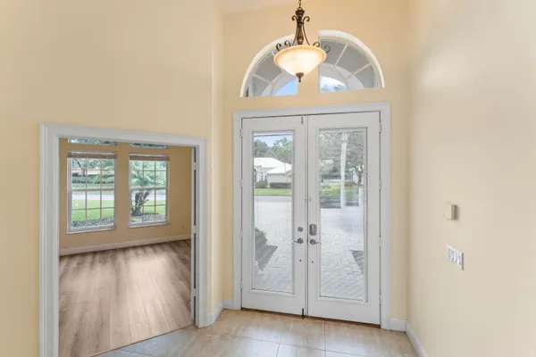 a view of an entryway with wooden floor