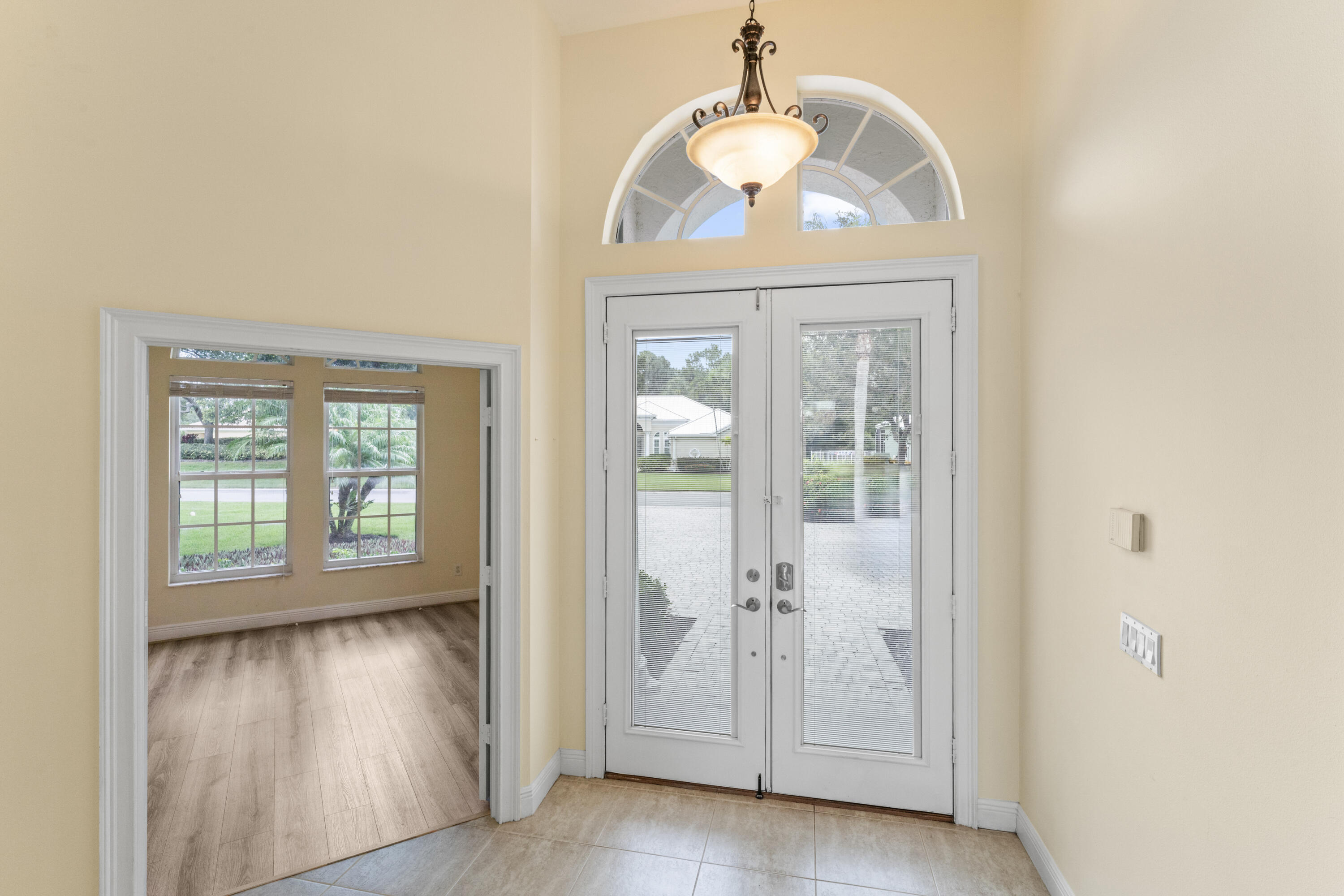 918 Southwest Blue Stem Way Stuart, FL 34997 - Photo 5 of 47 a view of an entryway with wooden floor