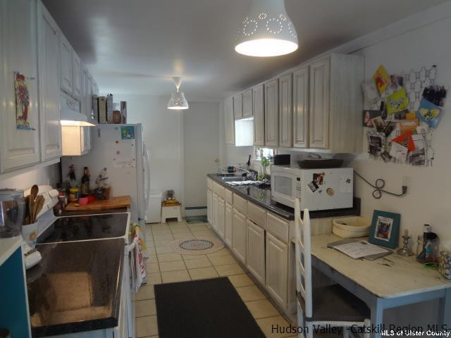 65 Pancake Hollow Road Highland, NY 12528 - Photo 3 of 19 a kitchen with stainless steel appliances a stove a sink and a refrigerator