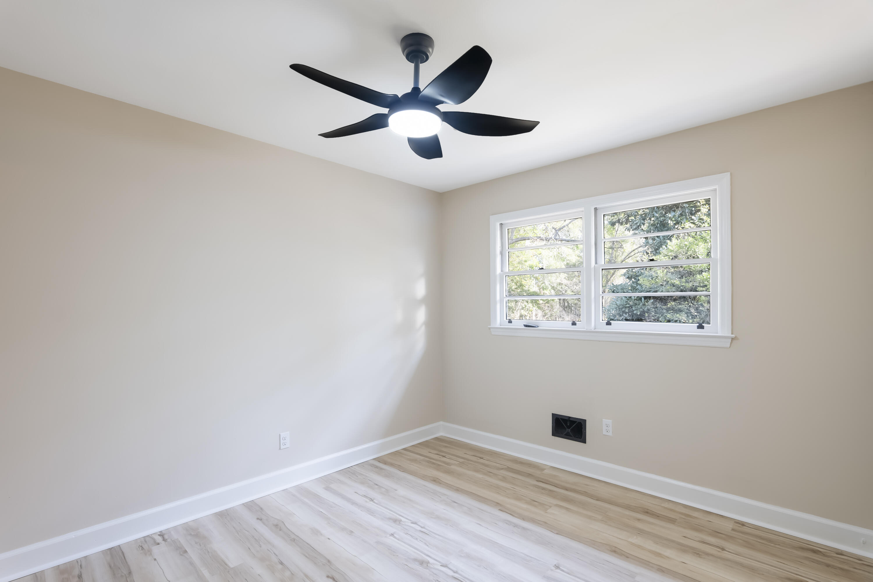 39 Gantt Street Wagener, SC 29164 - Photo 6 of 30 wooden floor in an empty room with a window