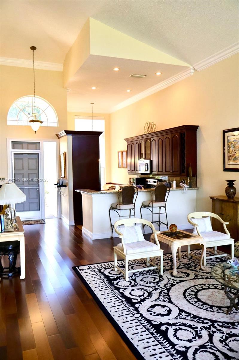 17246 Boca Club Boulevard, Unit 102 Boca Raton, FL 33487 - Photo 12 of 50 a living room with furniture and wooden floor