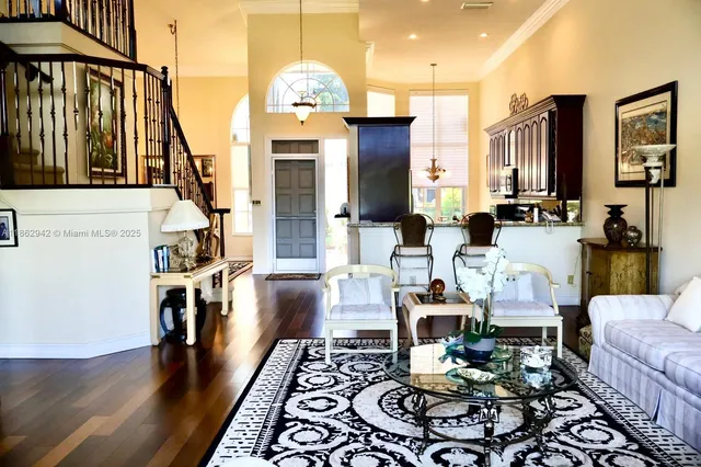 a living room with furniture fireplace and a table