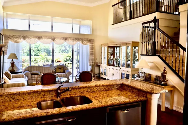 a view of living room with furniture and floor to ceiling windows