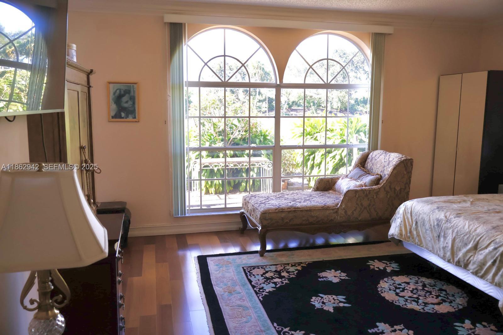 17246 Boca Club Boulevard, Unit 102 Boca Raton, FL 33487 - Photo 22 of 50 a living room with furniture and a window