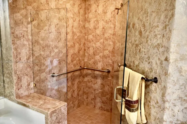 a bathroom with a shower curtain and a sink