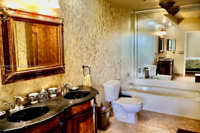 a bathroom with a sink a toilet and a bathtub