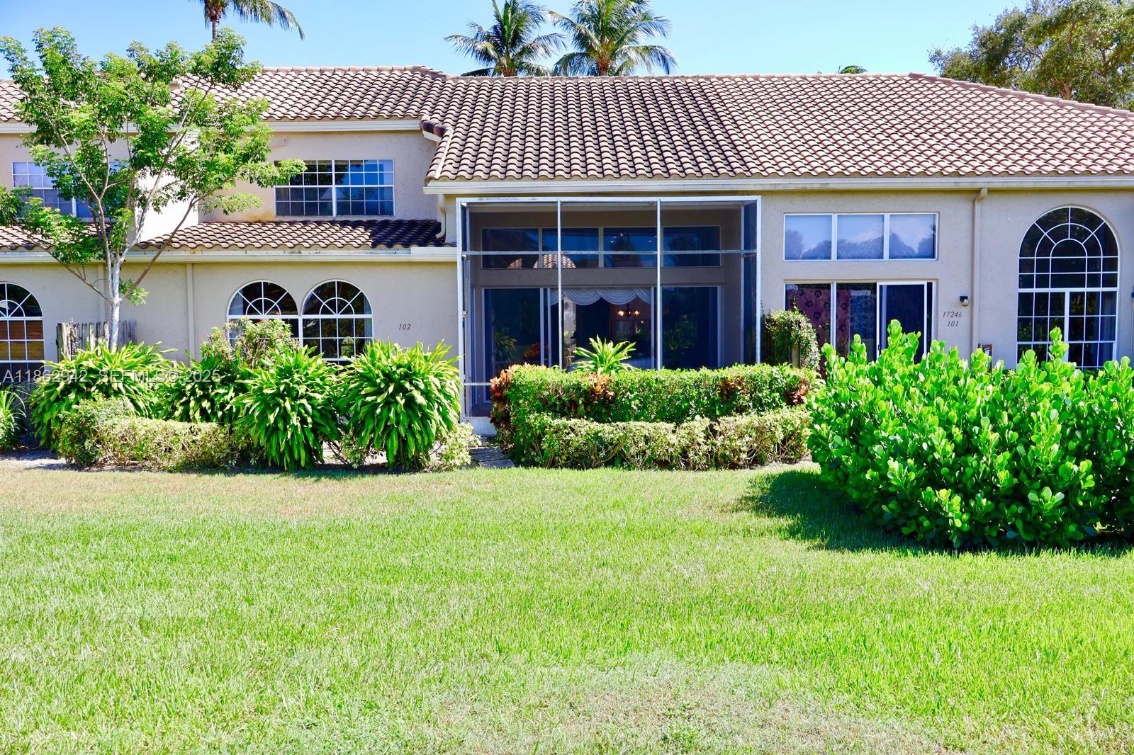 17246 Boca Club Boulevard, Unit 102 Boca Raton, FL 33487 - Photo 4 of 50 a view of a house with a garden