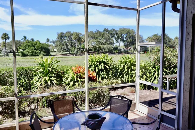 a view of a balcony with chairs