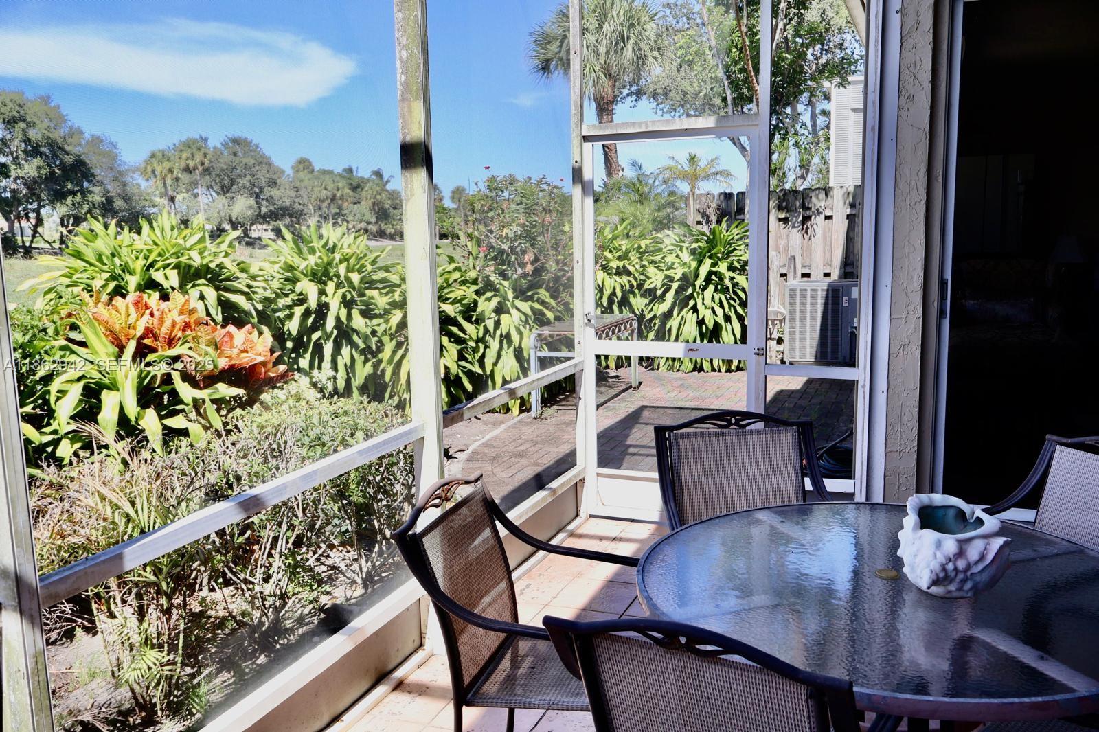 17246 Boca Club Boulevard, Unit 102 Boca Raton, FL 33487 - Photo 44 of 50 a balcony view with couple of chairs