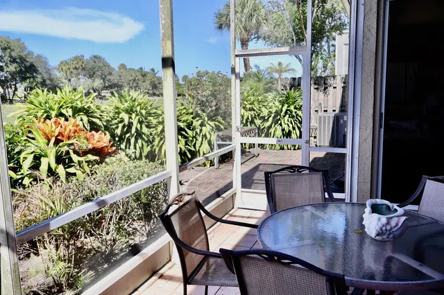 a balcony view with couple of chairs
